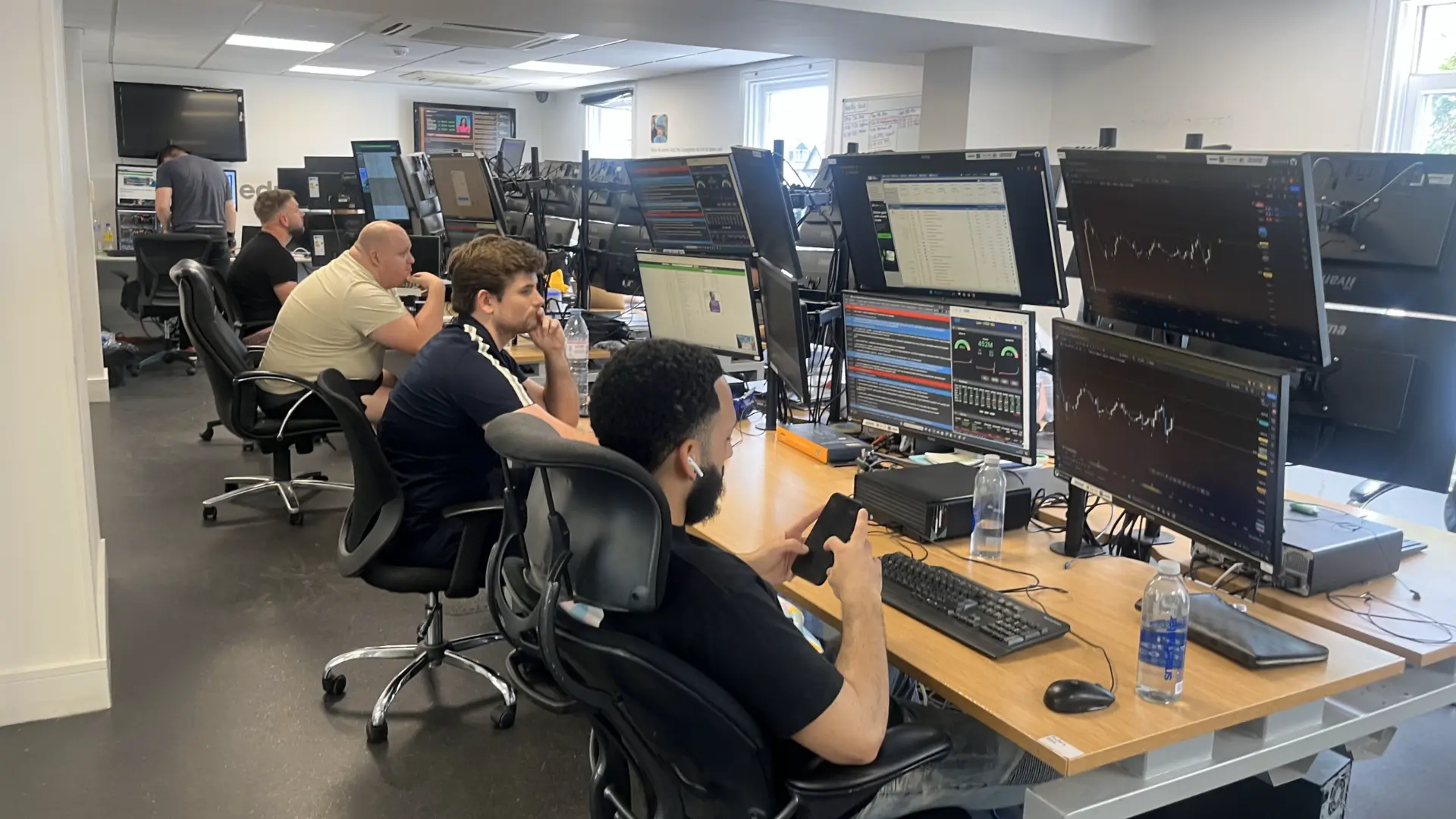 Traders working on the Educate2Trade live trading floor