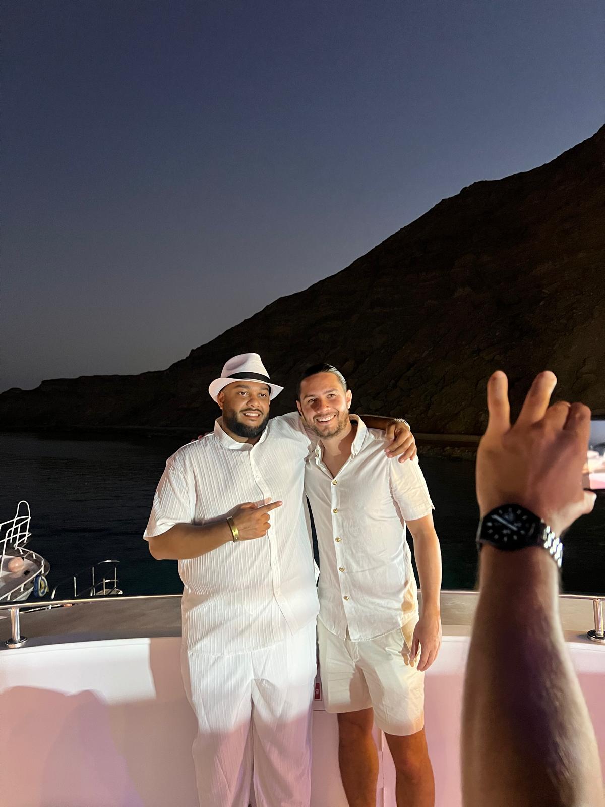 Educate2Trade team members on a boat at night in Egypt