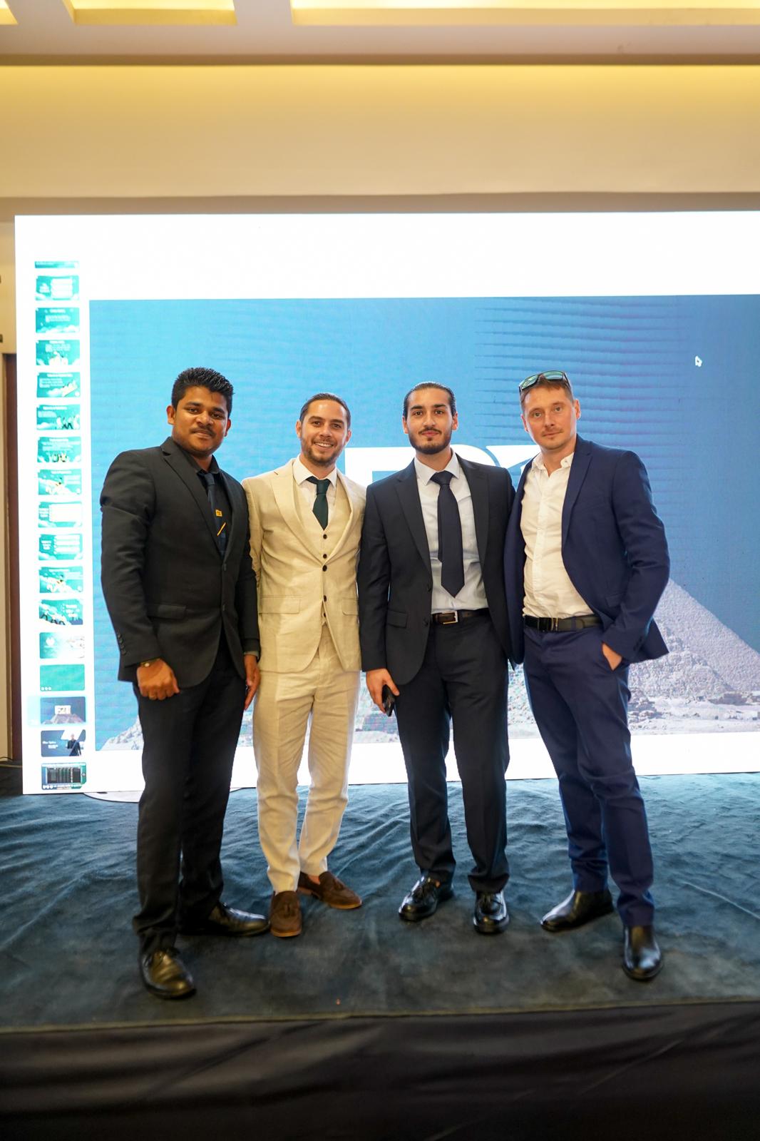 Educate2Trade team in suits at an event in Egypt